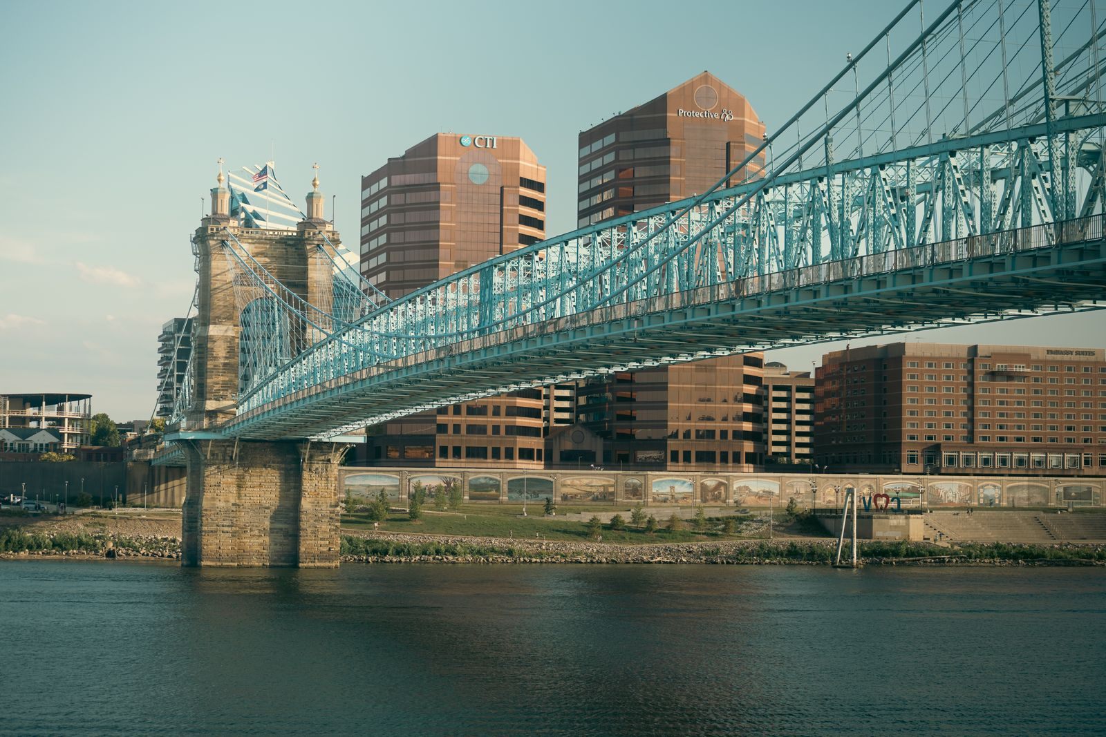 The blue Roebling Suspension Bridge over the Ohio River at Cincinnati, a landmark on Ohio River cruises