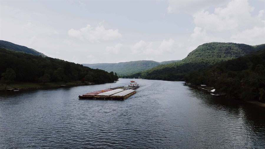 A barge on the Tennessee River in the wooded gorge below Chattanooga